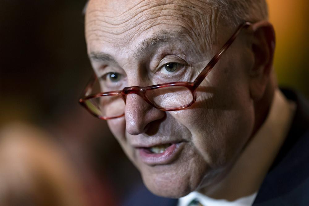 Senate Majority Leader Chuck Schumer, D-N.Y., meets with reporters at the Capitol in Washington, Tuesday. The Senate voted unanimously Thursday to suspend normal trade relations with Russia and ban the importation of its oil.