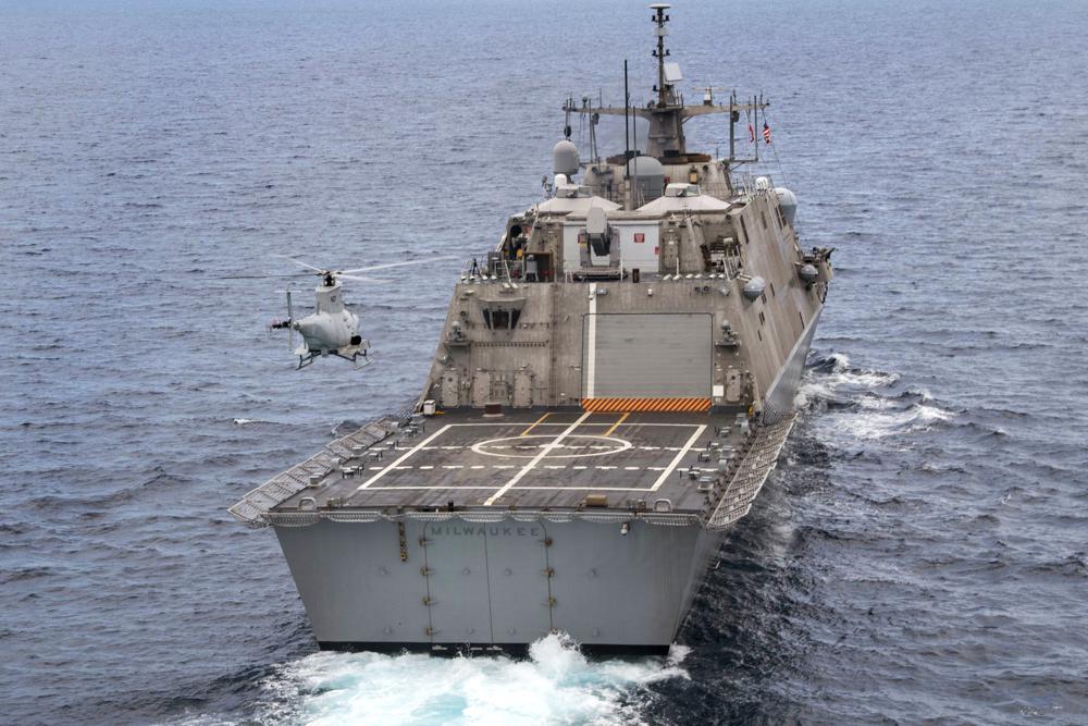 The USS Milwaukee, a Freedom-class of littoral combat ship, cruises underway as an MQ-8B Fire Scout unmanned aerial vehicle hovers during flight operations on June 27, 2019, in the Atlantic Ocean. The Navy that once wanted smaller, speedy warships to chase down pirates has made a speedy pivot to Russia and China and many of those ships, like the USS Milwaukee, could be retired.