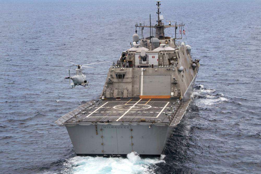The USS Milwaukee, a Freedom-class of littoral combat ship, cruises underway as an MQ-8B Fire Scout unmanned aerial vehicle hovers during flight operations on June 27, 2019, in the Atlantic Ocean. The Navy that once wanted smaller, speedy warships to chase down pirates has made a speedy pivot to Russia and China and many of those ships, like the USS Milwaukee, could be retired.