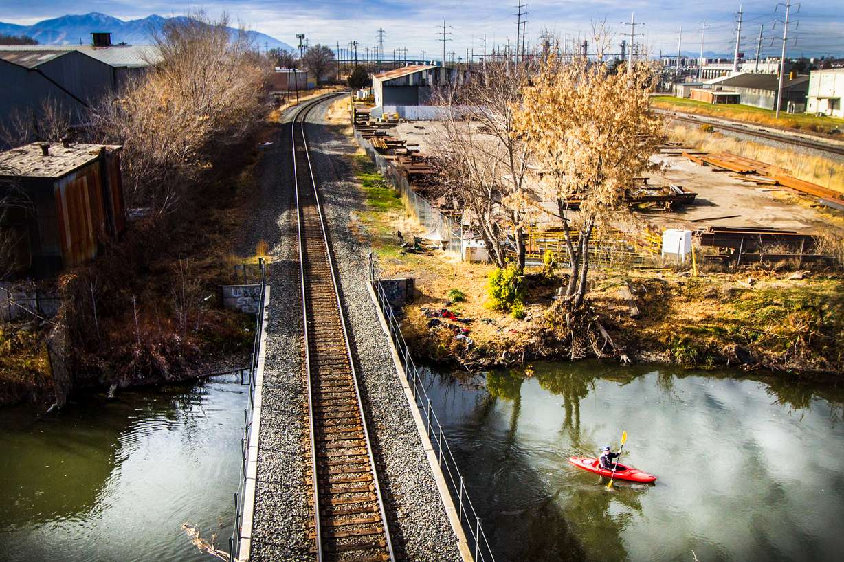 A kayaker navigating through the Jordan River near North Temple in Salt Lake City on Nov. 25, 2017.