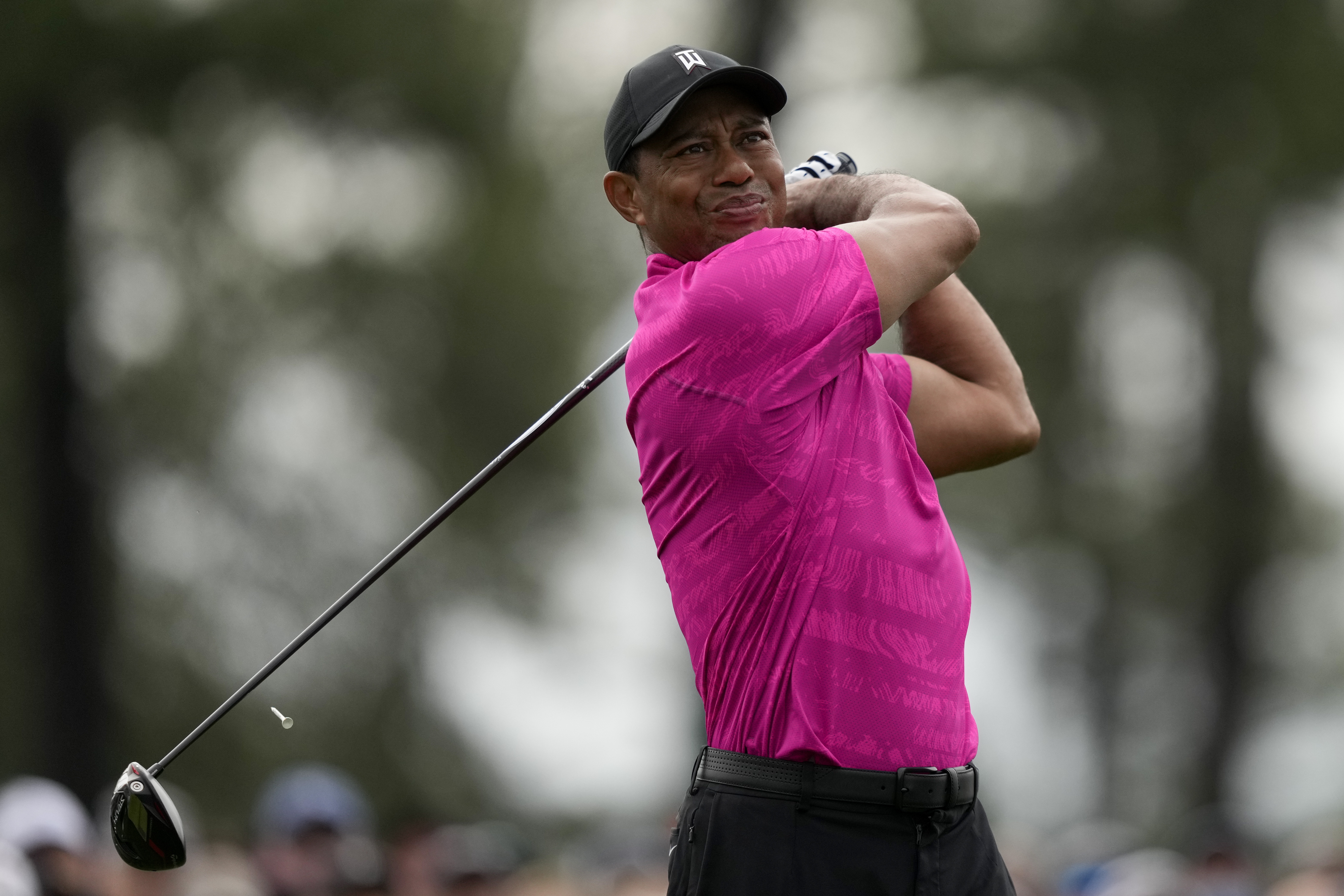 Tiger Woods watches his tee shot on the first hole during the first round at the Masters golf tournament on Thursday, April 7, 2022, in Augusta, Ga.