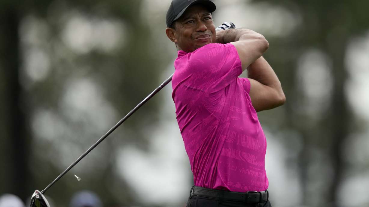Tiger Woods watches his tee shot on the first hole during the first round at the Masters golf tournament on Thursday, April 7, 2022, in Augusta, Ga.