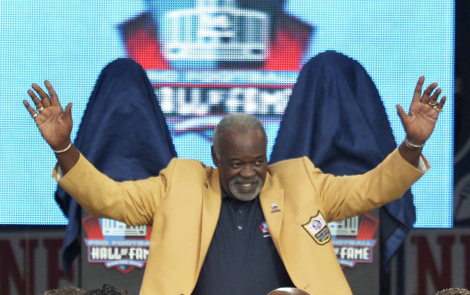 FILE - Rayfield Wright is introduced during the Pro Football Hall of Fame enshrinement ceremony Aug. 2, 2014, in Canton, Ohio. Wright, the Pro Football Hall of Fame offensive tackle nicknamed “Big Cat” who went to five Super Bowls in his 13 NFL seasons with the Dallas Cowboys, has died. He was 76. Wright's family confirmed his death Thursday, April 7, 2022, to the Pro Football Hall of Fame.  
