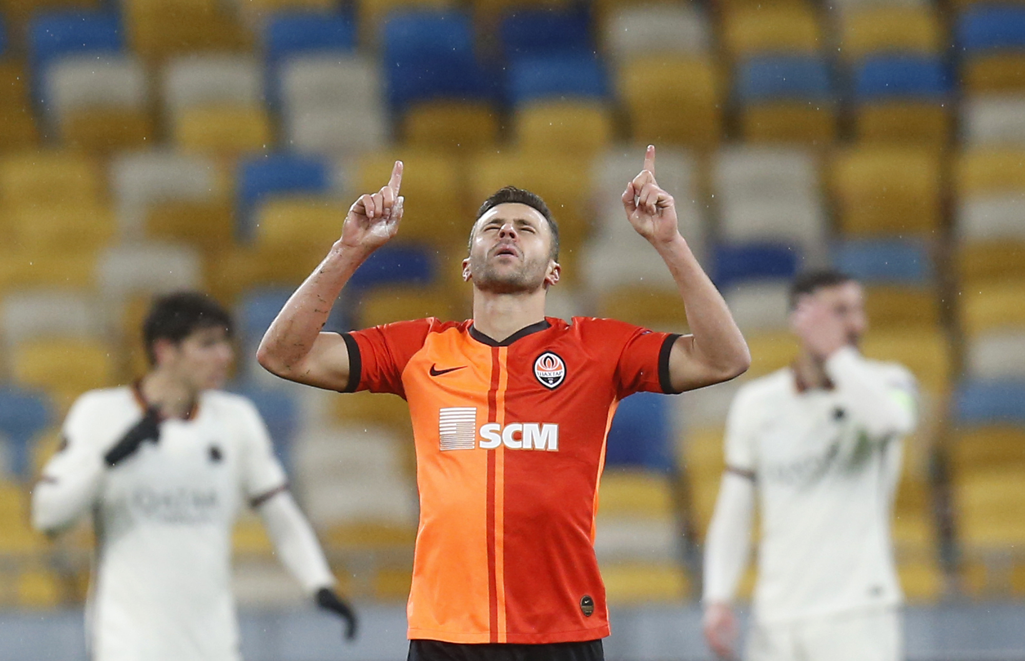FILE - Shakhtar's Junior Moraes celebrates after scoring his side's opening goal during the Europa League round of 16 second leg soccer match between Shakhtar Donetsk and Roma at the Olimpiyskiy Stadium in Kyiv, Ukraine, on March 18, 2021. Veteran striker Junior Moraes has returned to Brazil to join Corinthians, but on Tuesday he admitted his mind far from sport. The 34-year-old Moraes, who obtained Ukrainian citizenship three years ago, fears for his friends, colleagues and teammates amid Russia's invasion of the European country. 