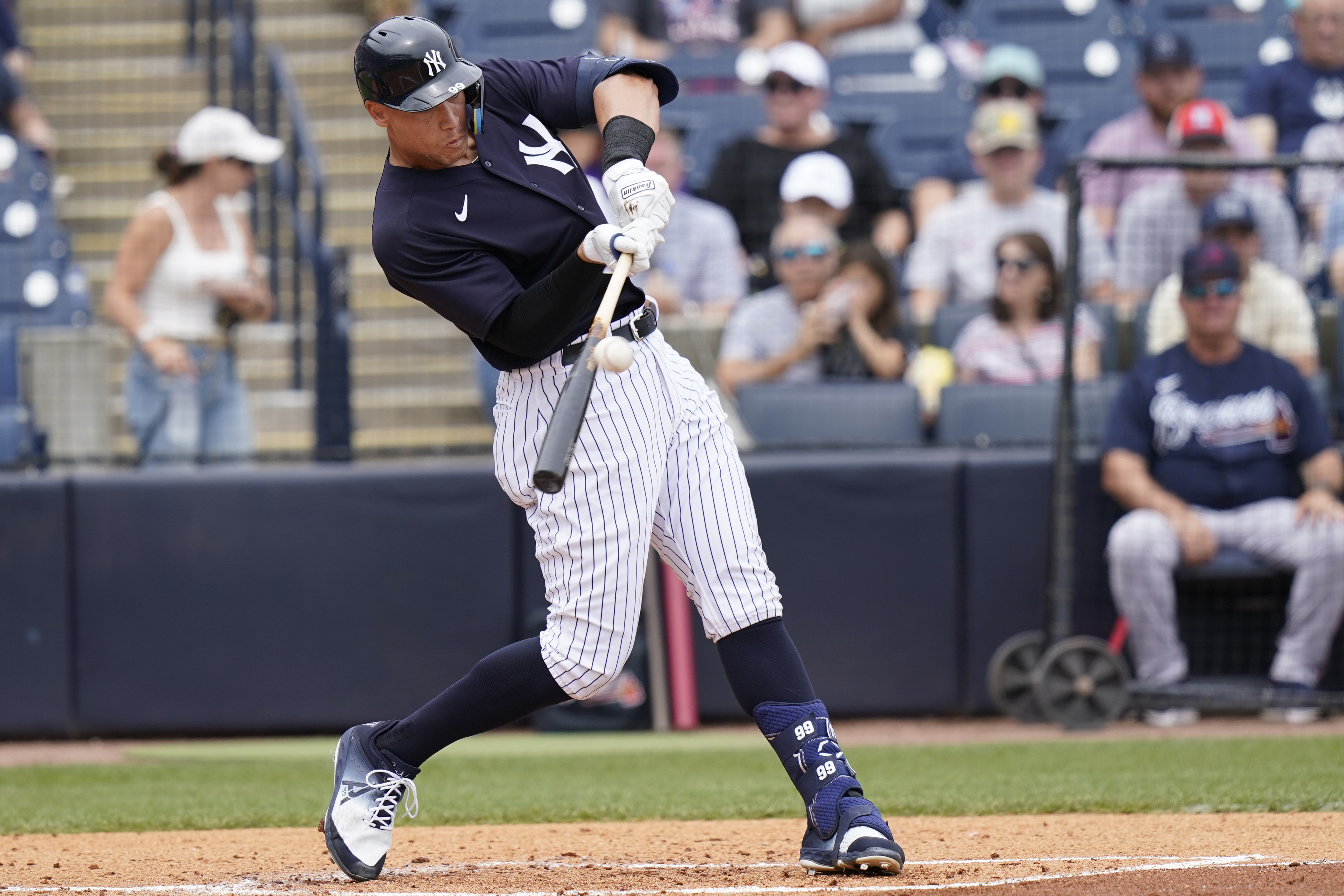 New York Yankees' Aaron Judge hits a solo home run during the first inning of a spring training baseball game against the Atlanta Braves, Saturday, April 2, 2022, in Tampa, Fla. 