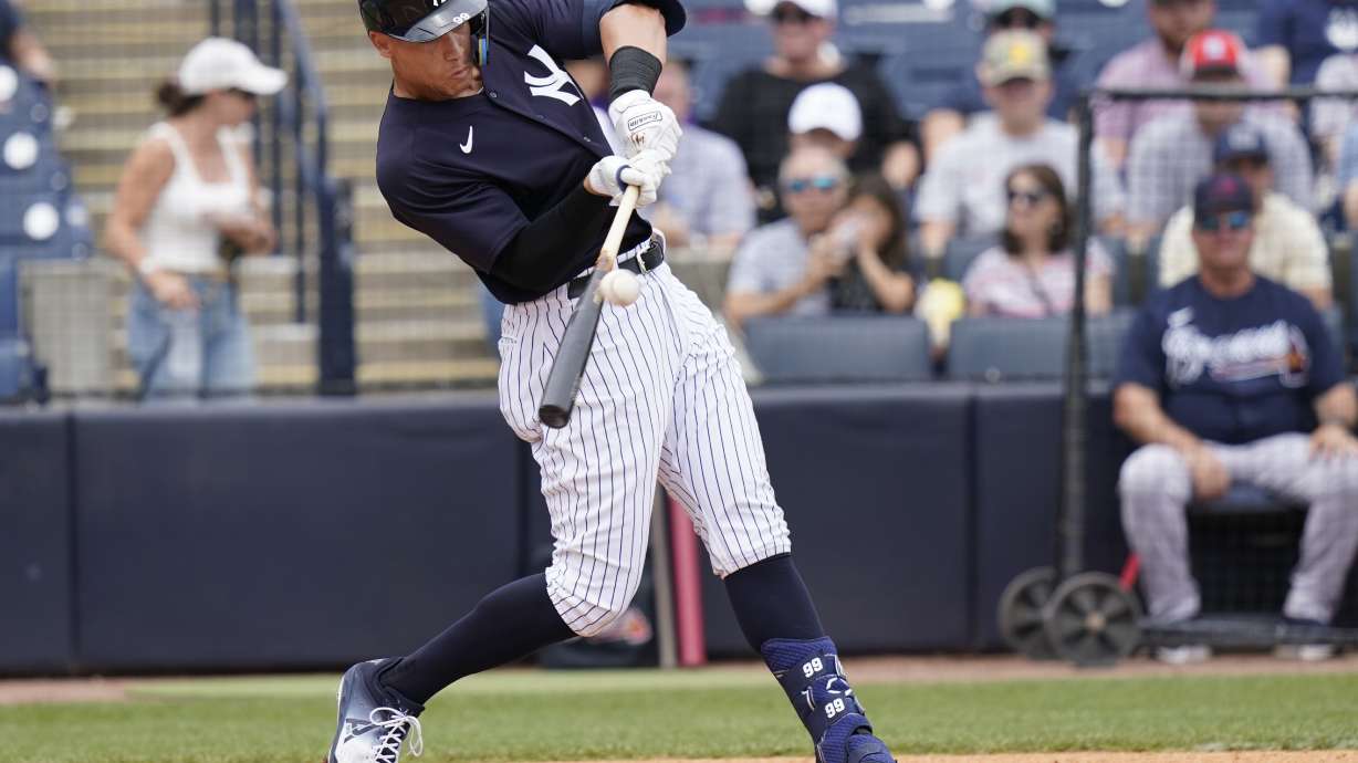 New York Yankees' Aaron Judge hits a solo home run during the first inning of a spring training baseball game against the Atlanta Braves, Saturday, April 2, 2022, in Tampa, Fla.