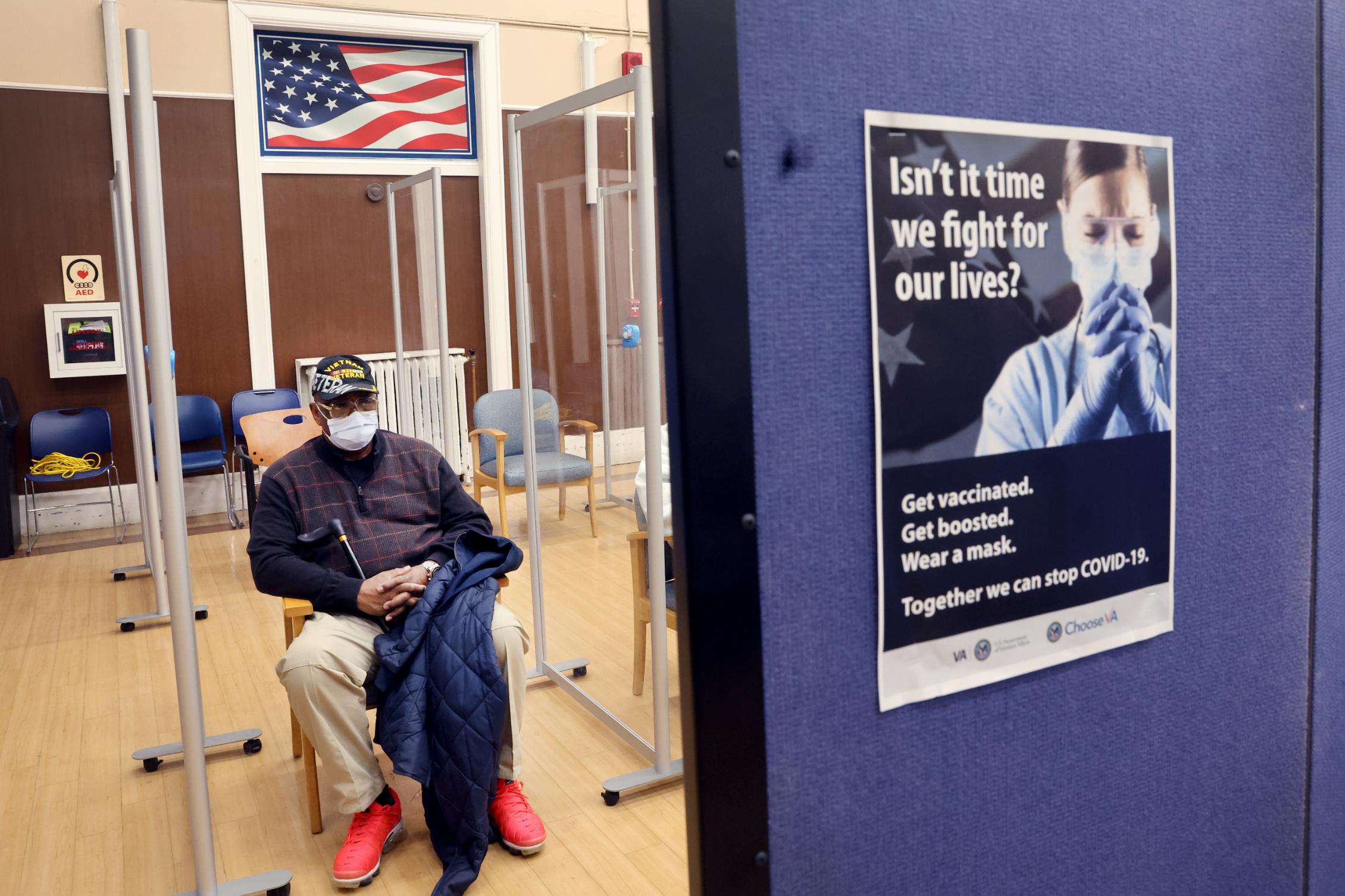 Army veteran Robert Hall waits the recommended 15 minutes to see if he will have any adverse reactions after receiving his second COVID-19 booster shot at Edward Hines Jr. VA Hospital on April 1 in Hines, Illinois. More people can now get second COVID-19 booster shots after federal health officials announced they are allowing a broader group to get fourth doses of the two vaccines made by Pfizer/BioNTech and Moderna.