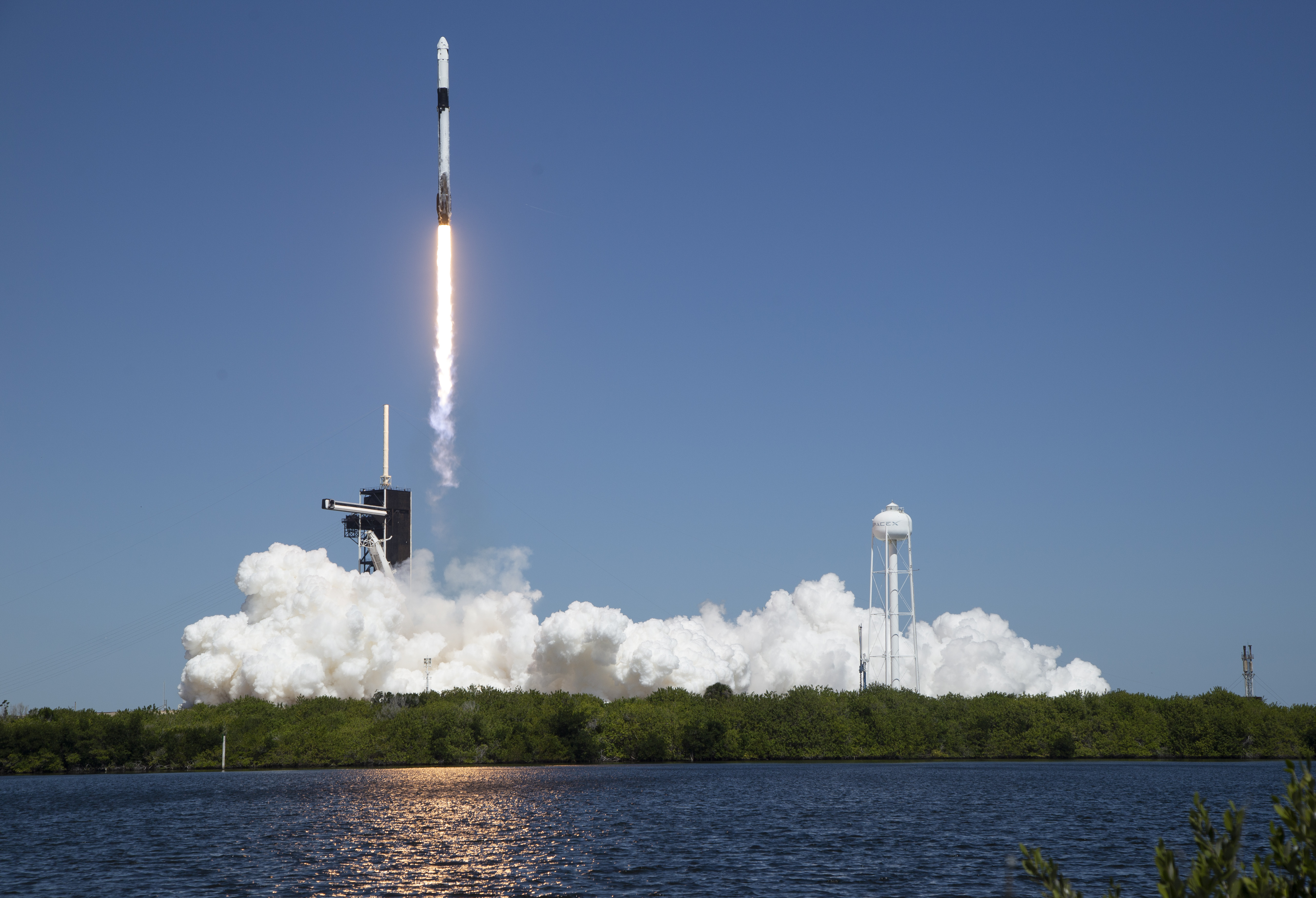 In this image provided by NASA, a SpaceX Falcon 9 rocket, with the Crew Dragon capsule attached, lifts off with the first private crew from Launch Complex 39A.The mission launched from Kennedy Space Center in Florida on Friday has arrived at ISS.