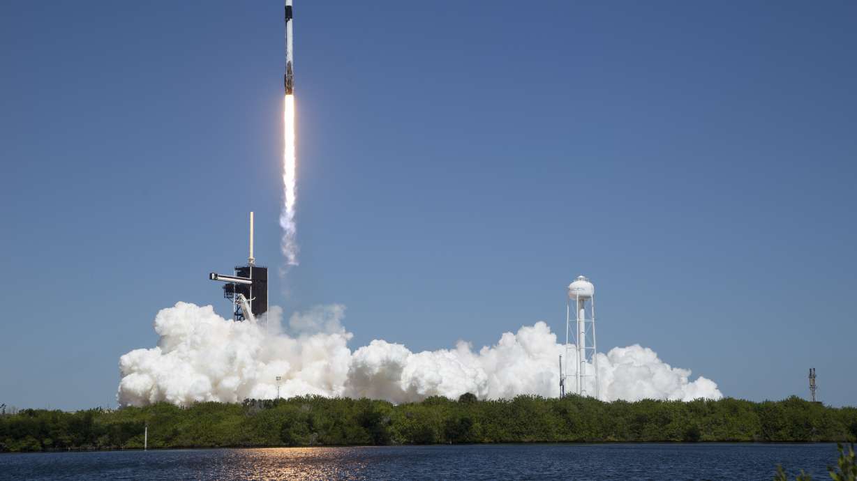 In this image provided by NASA, a SpaceX Falcon 9 rocket, with the Crew Dragon capsule attached, lifts off with the first private crew from Launch Complex 39A.The mission launched from Kennedy Space Center in Florida on Friday has arrived at ISS.
