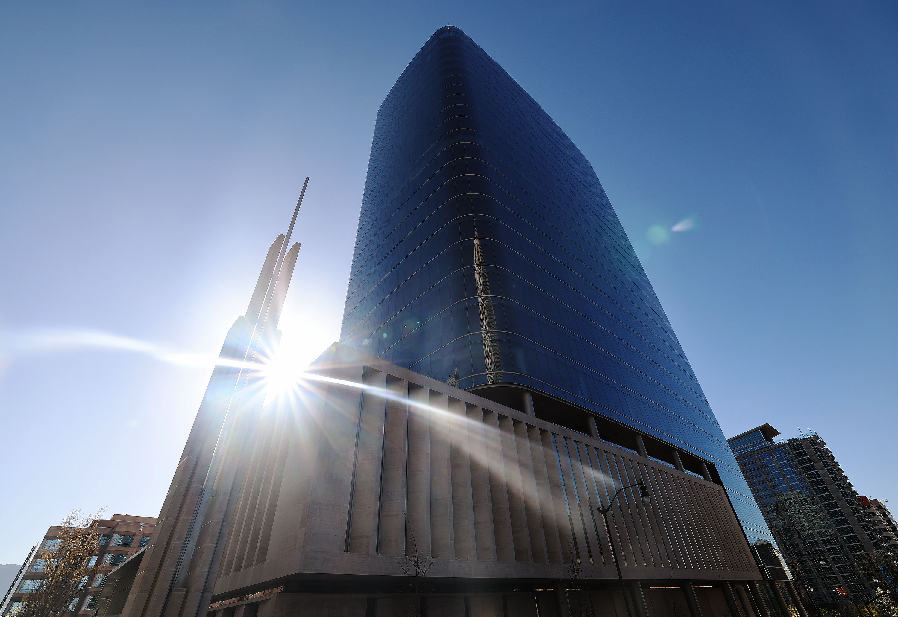 The sun rises on two new urban chapels of The Church of Jesus Christ of Latter-day Saints, built at the base of the new 95 State Office Tower on State Street in Salt Lake City, on Friday.