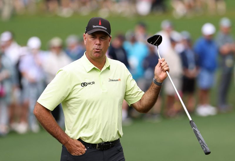 FILE PHOTO: Golf - The Masters - Augusta National Golf Club - Augusta, Georgia, U.S. - April 7, 2022 Stewart Cink of the U.S. reacts after a putt on the 2nd green during the first round