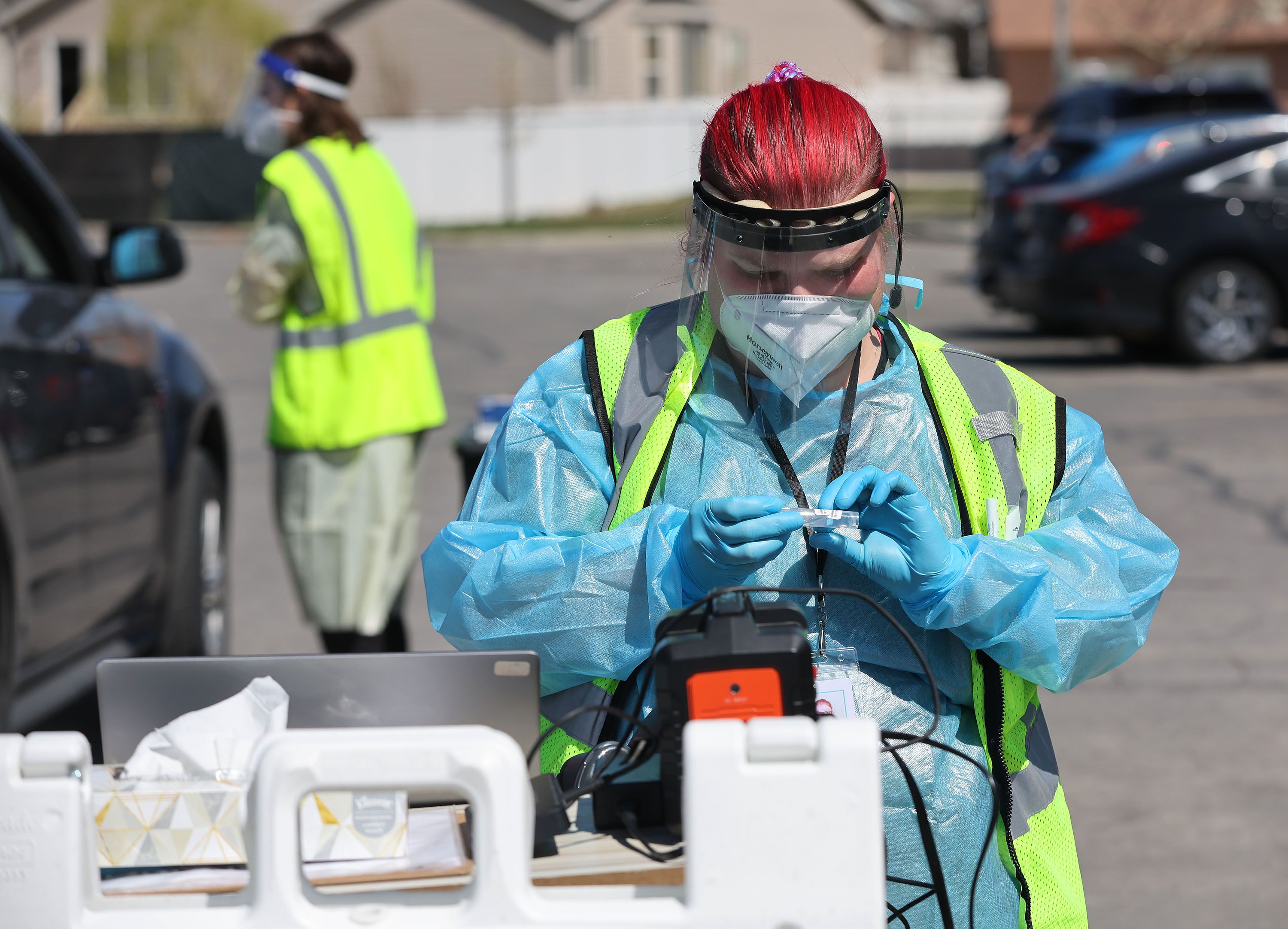 Megan Clay prepares a COVID-19 test in West Valley City on Friday.
