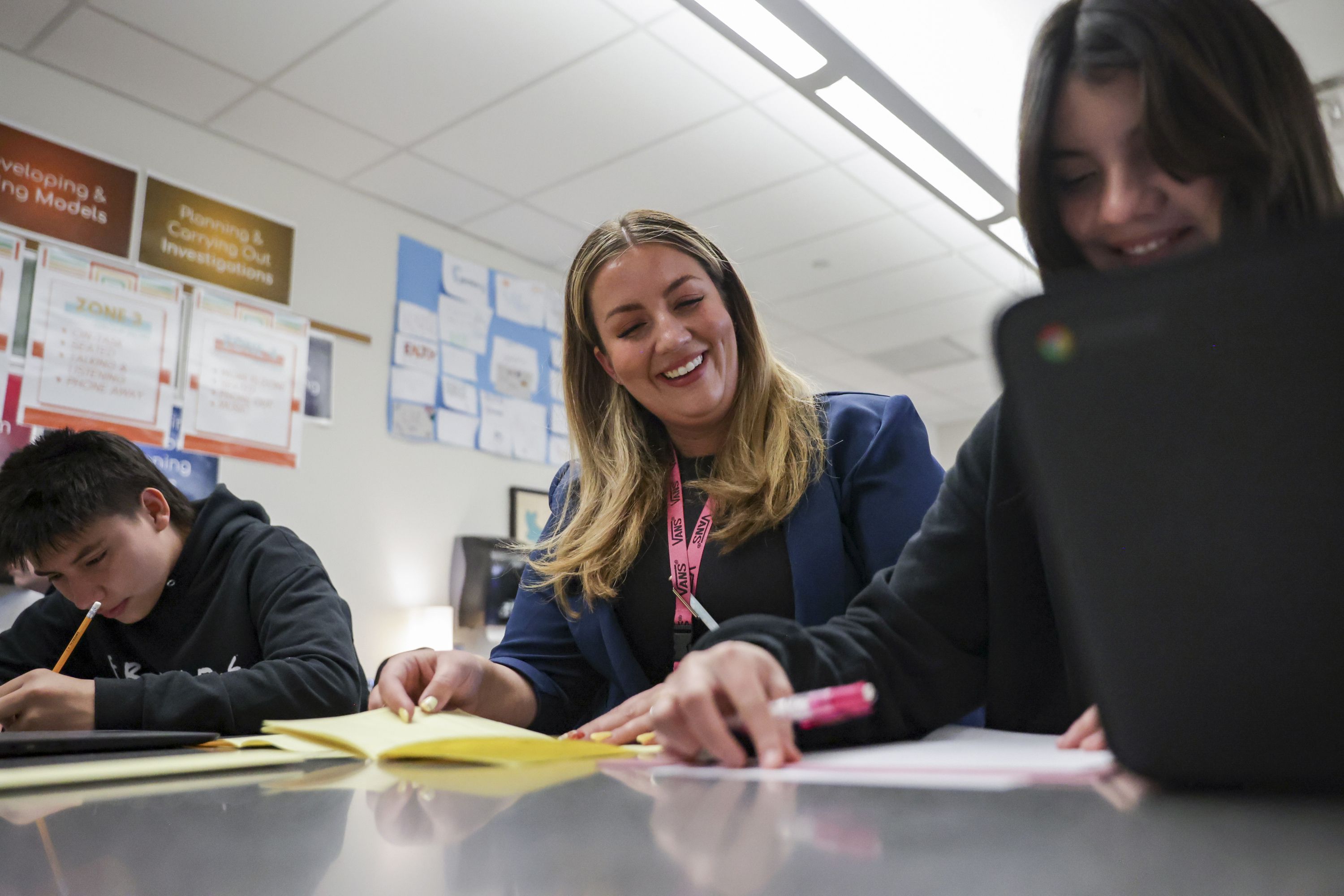 Middle school teacher Alisha Wheeler laughs with eighth grade student Sofia Garcia Navarro during her class at Copper Mountain Middle School in Herriman on Friday.