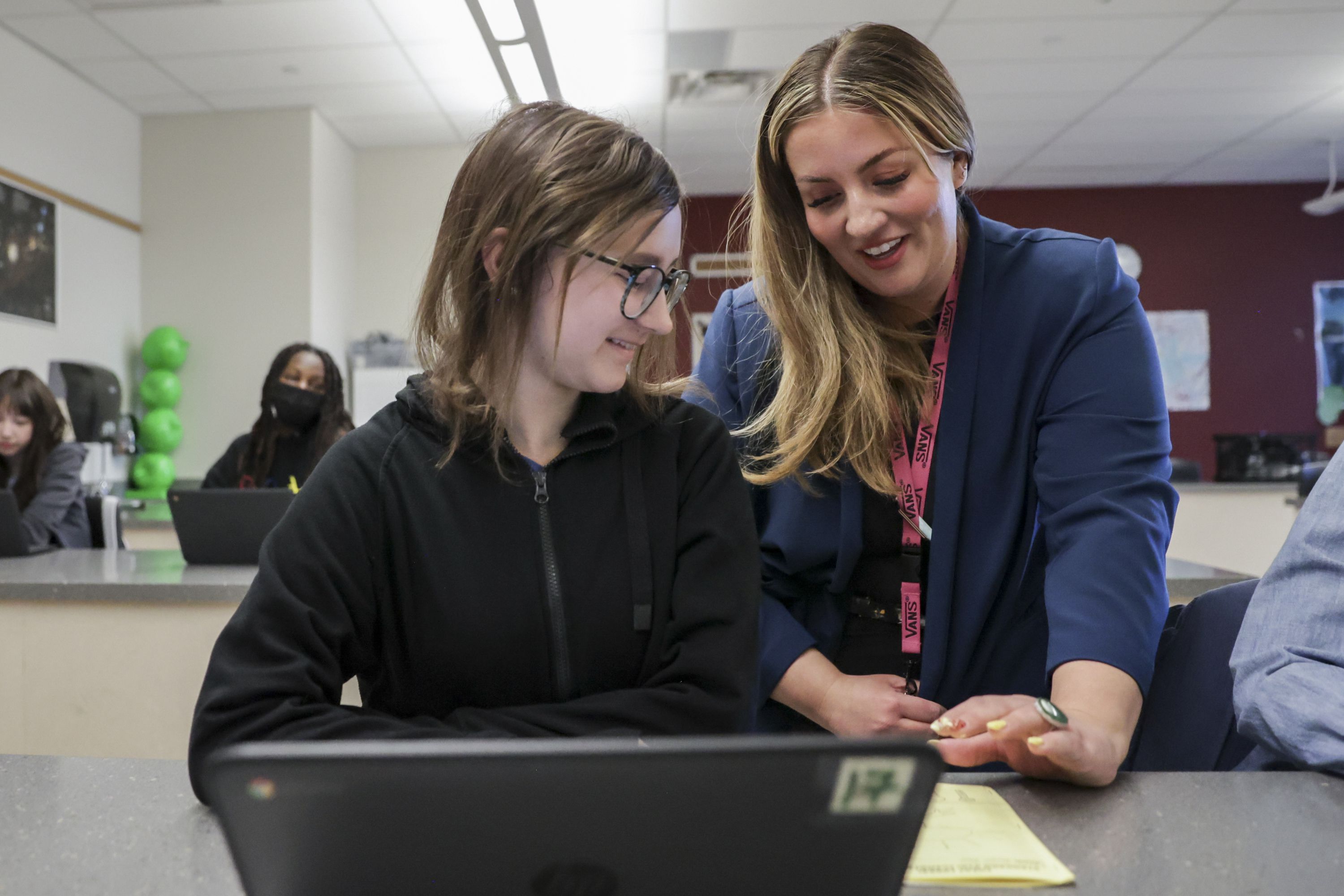 Middle school teacher Alisha Wheeler talks to eighth grade student Jenna Yates during her class at Copper Mountain Middle School in Herriman on Friday.