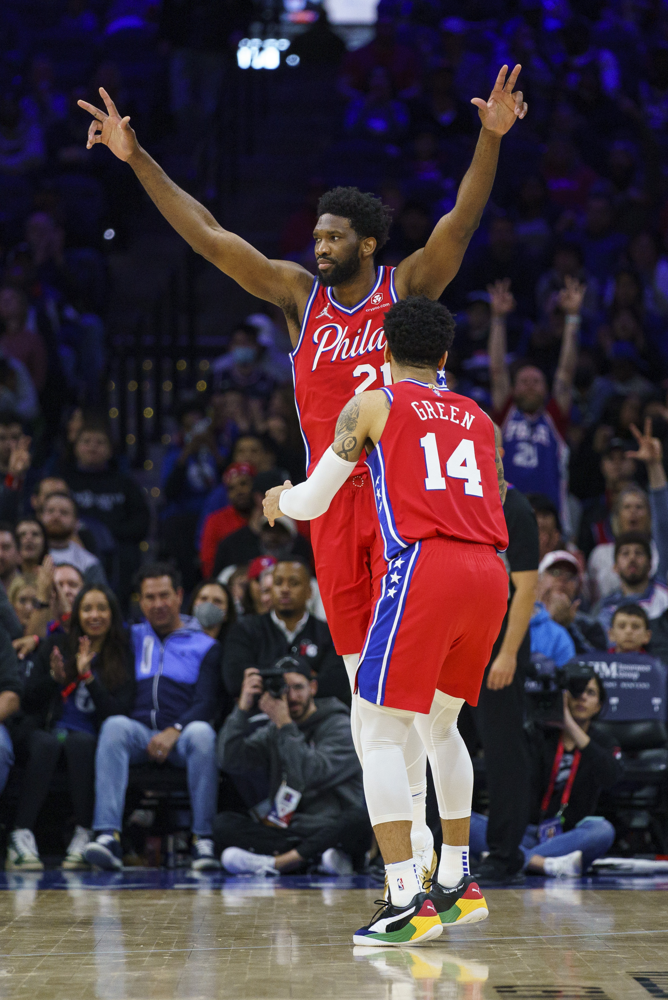 Philadelphia 76ers' Joel Embiid, left, reacts to the basket by Danny Green, right, during the first half of an NBA basketball game against the Indiana Pacers, Saturday, April 9, 2022, in Philadelphia.