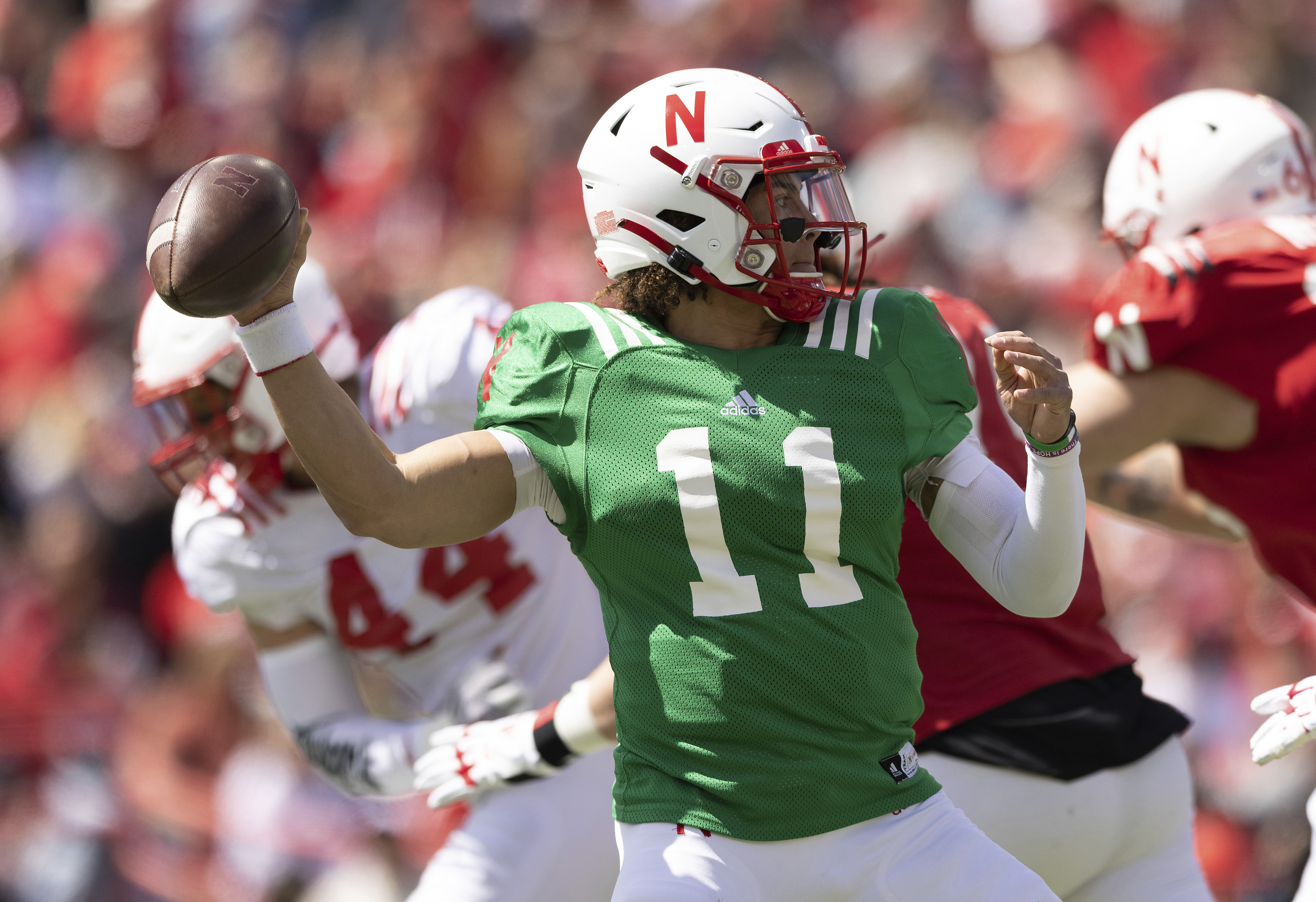 Nebraska red team quarterback Casey Thompson (11) passes the ball against the white team during the first half of Nebraska's NCAA college football annual red-white spring game at Memorial Stadium in Lincoln, Neb., Saturday, April 9, 2022.