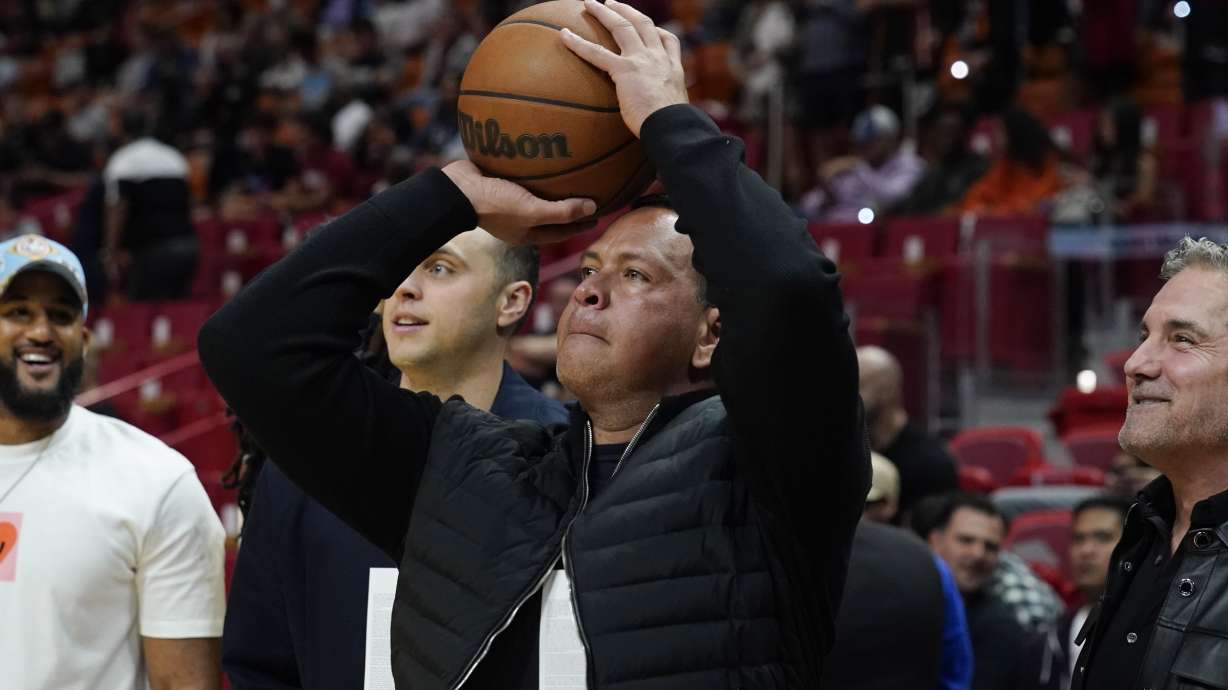Alex Rodriguez, partial owner of the Minnesota Timberwolves NBA team aims a shot at the basket before the first half of an NBA basketball game against the Miami Heat, Saturday, March 12, 2022, in Miami.