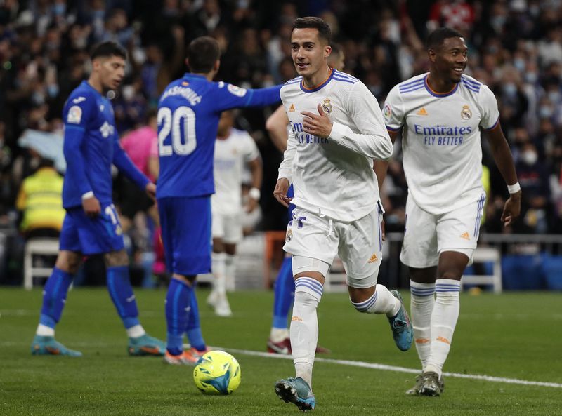 Soccer Football - LaLiga - Real Madrid v Getafe - Santiago Bernabeu, Madrid, Spain - April 9, 2022  Real Madrid's Lucas Vazquez celebrates scoring their second goal with David Alaba