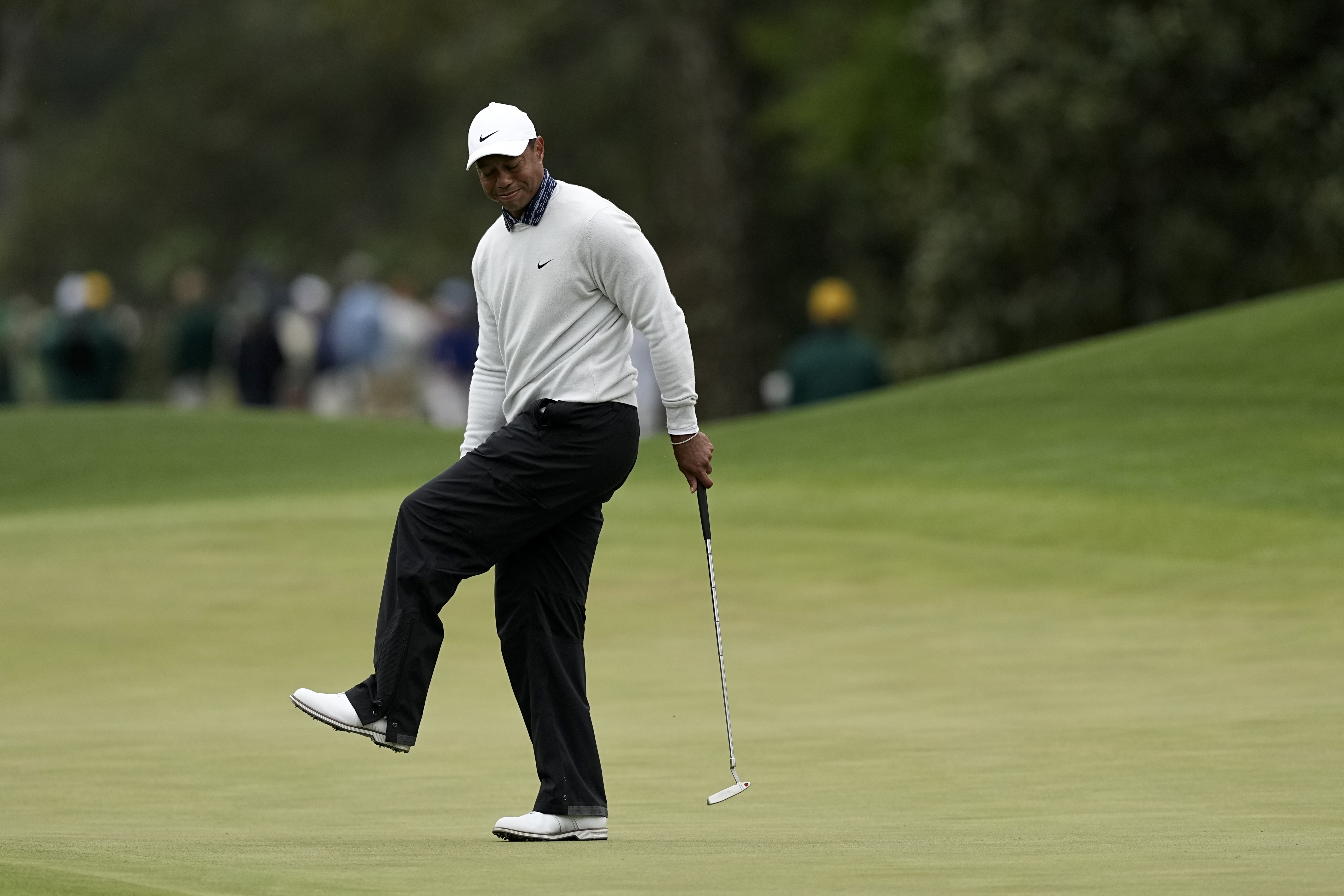 Tiger Woods reacts after missing a birdie putt on the eighth green during the third round at the Masters golf tournament on Saturday, April 9, 2022, in Augusta, Ga. 