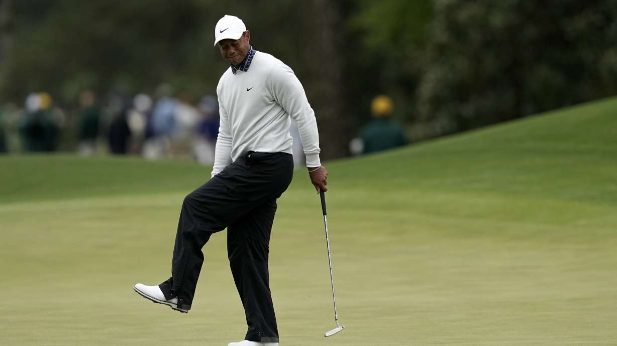 Tiger Woods reacts after missing a birdie putt on the eighth green during the third round at the Masters golf tournament on Saturday, April 9, 2022, in Augusta, Ga.