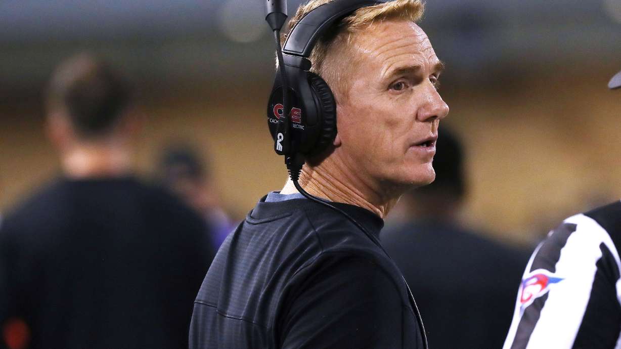 Utah State University football coach Blake Anderson talks with a referee during a game in Logan on Friday Oct 1, 2021.