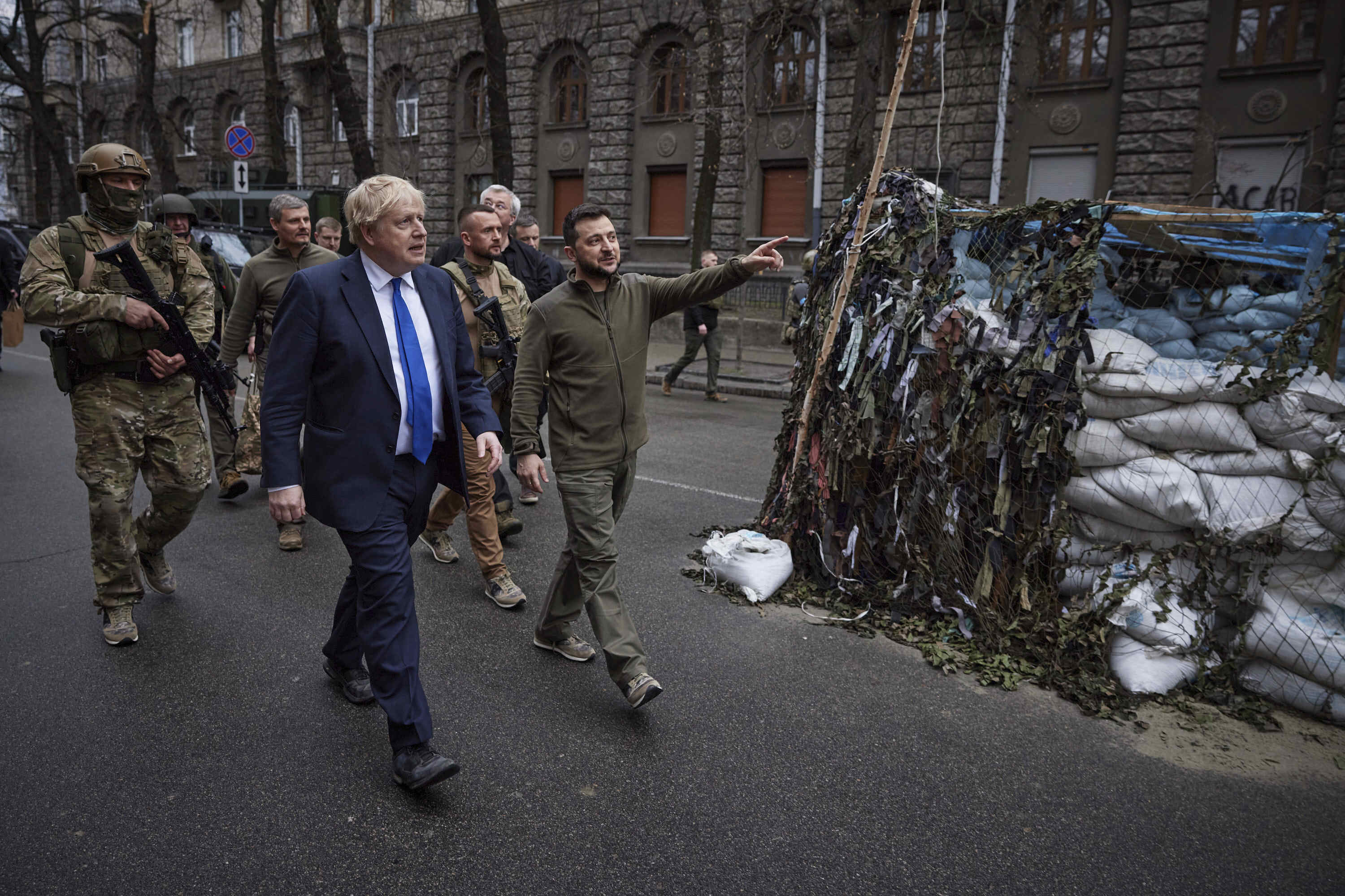 In this image provided by the Ukrainian Presidential Press Office, Ukrainian President Volodymyr Zelenskyy, center, and Britain's Prime Minister Boris Johnson, center left, walk in downtown Kyiv, Ukraine, Saturday.