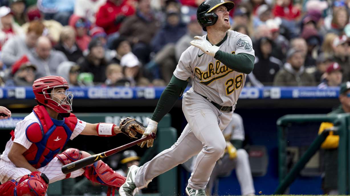 Oakland Athletics' Billy McKinney follows through on a home run during the seventh inning of a baseball game against the Philadelphia Phillies, Sunday, April 10, 2022, in Philadelphia.