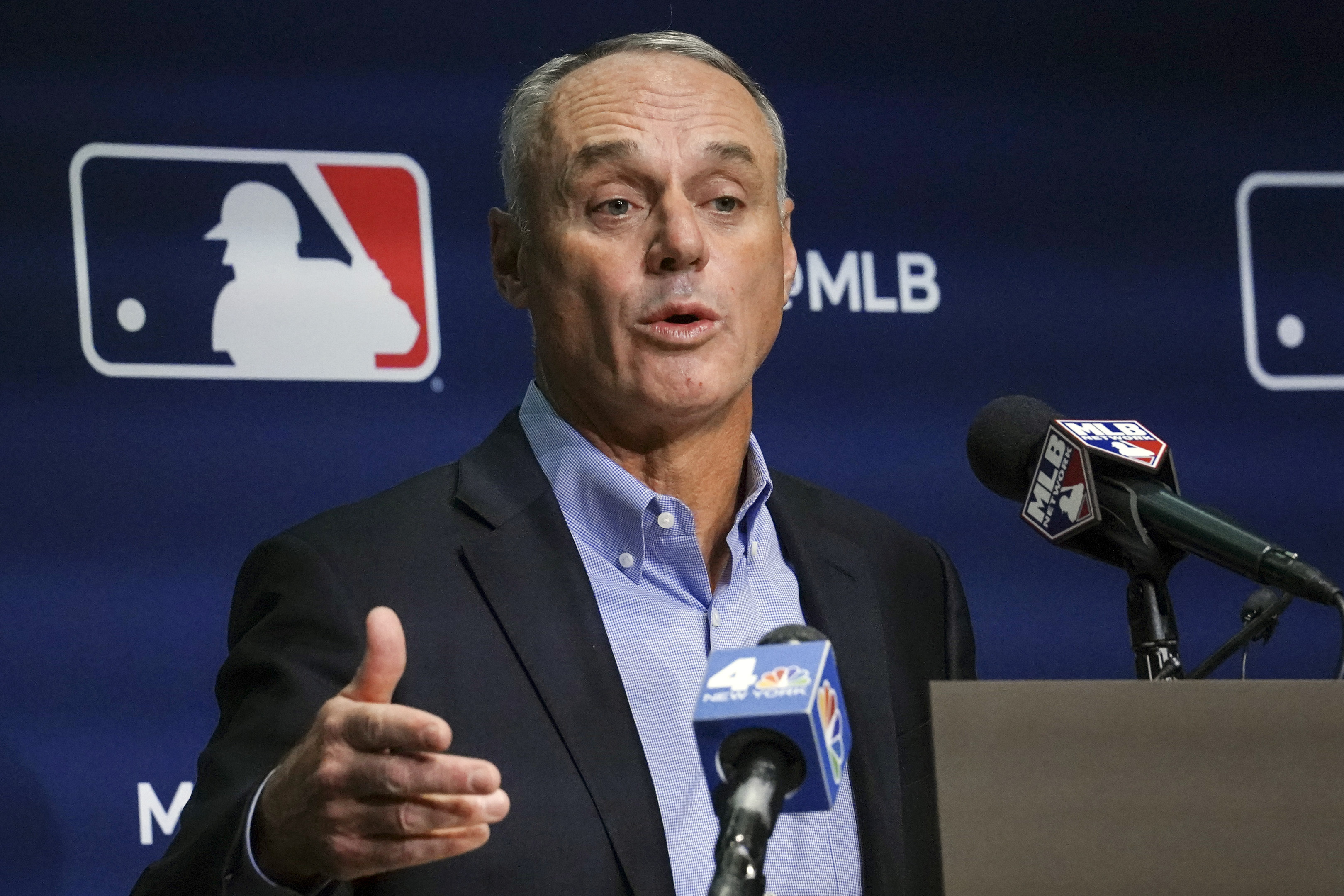 FILE -Major League Baseball commissioner Rob Manfred speaks during a news conference, Thursday March 10, 2022, in New York. About 1 in 4 fans of Major League Baseball feel at least some anger toward the sport after its first work stoppage in a generation, according to a new poll, but the vast majority are still excited about the new season. Only 27% of Americans say they are currently a fan of MLB, according to the poll from The Associated Press-NORC Center for Public Affairs Research. Baseball Commissioner Rob Manfred apologized to fans when the labor agreement was reached on March 10. 
