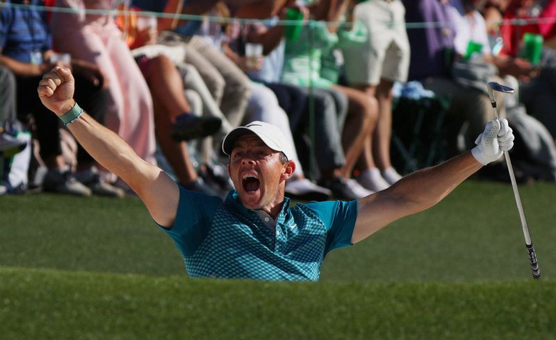 Golf - The Masters - Augusta National Golf Club - Augusta, Georgia, U.S. - April 10, 2022 Northern Ireland's Rory McIlroy celebrates after chipping in for birdie from the bunker on the 18th during his final round