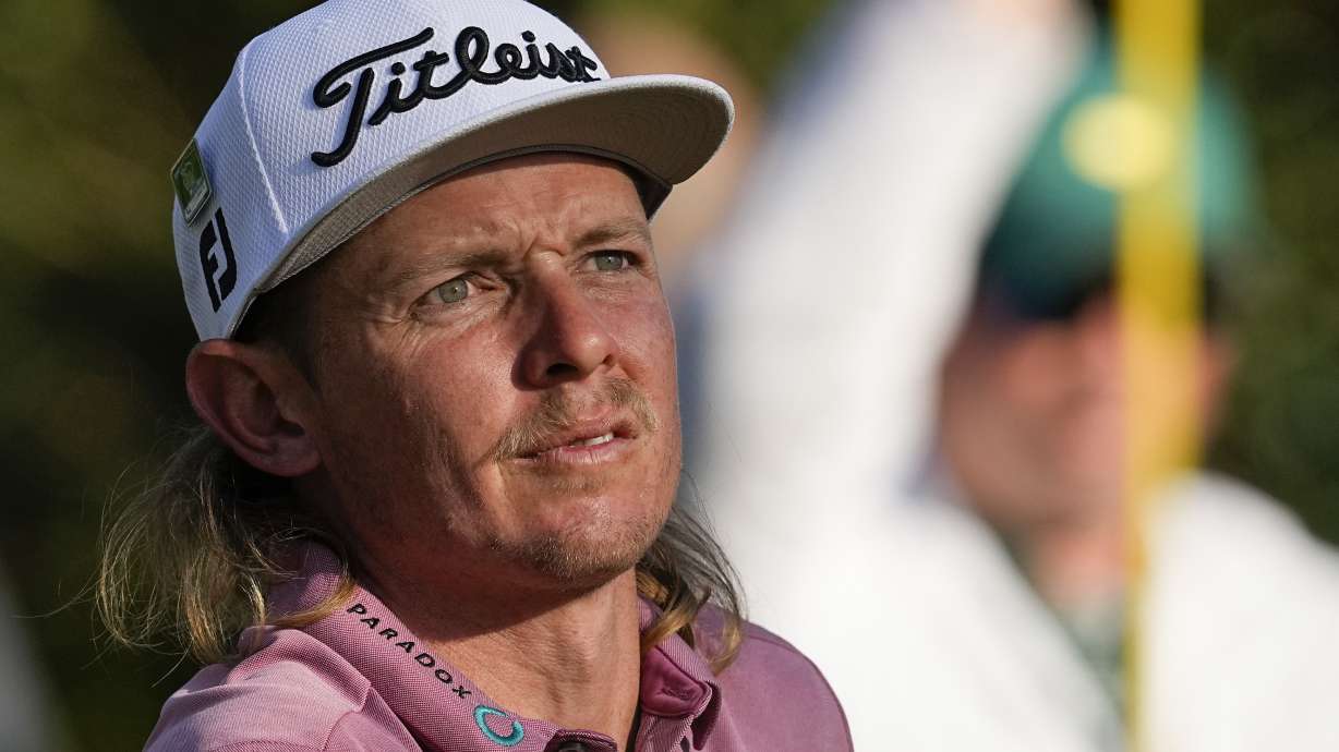 Cameron Smith, of Australia, watches his tee shot on the 15th hole during the final round at the Masters golf tournament on Sunday, April 10, 2022, in Augusta, Ga.