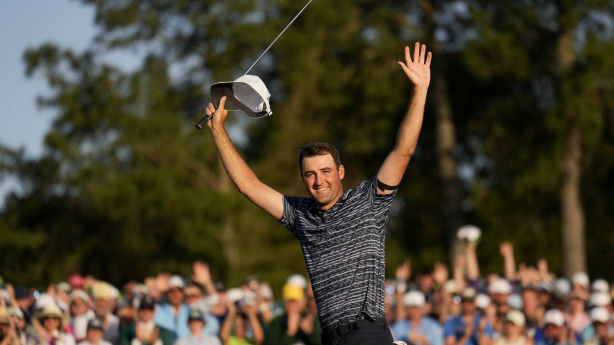 Scottie Scheffler celebrates after winning the 86th Masters golf tournament on Sunday, April 10, 2022, in Augusta, Ga.