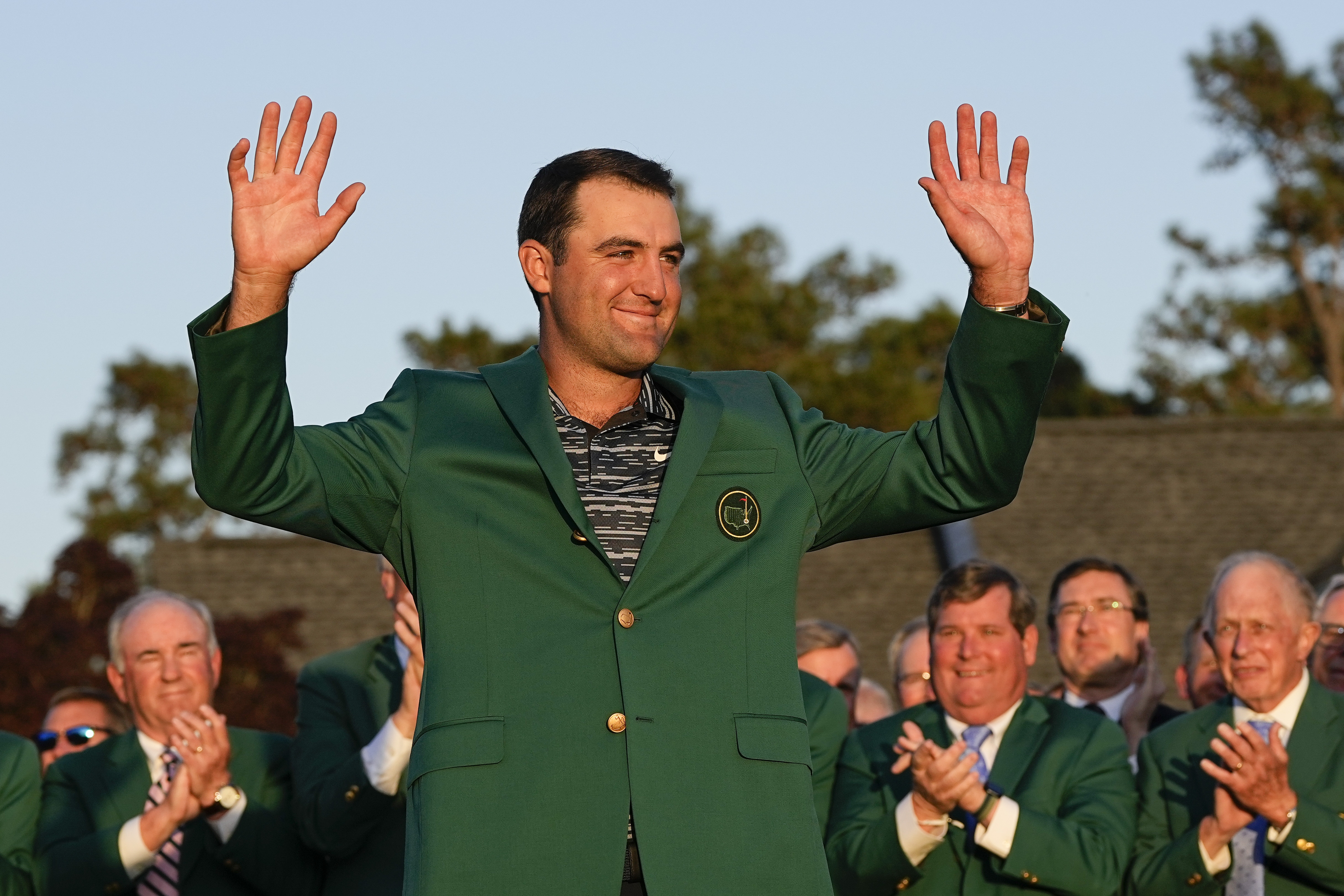 Scottie Scheffler celebrates after putting on the green jacket after winning the 86th Masters golf tournament on Sunday, April 10, 2022, in Augusta, Ga. 
