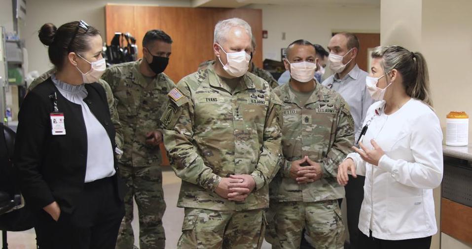 University of Utah Health staff speak with the U.S. Army North personnel in Salt Lake City on March 2, during a visit to the University of Utah Hospital. The U.S. military is taking lessons from the COVID-19 pandemic to prepare for the next crisis threatening a large population, whatever its nature.