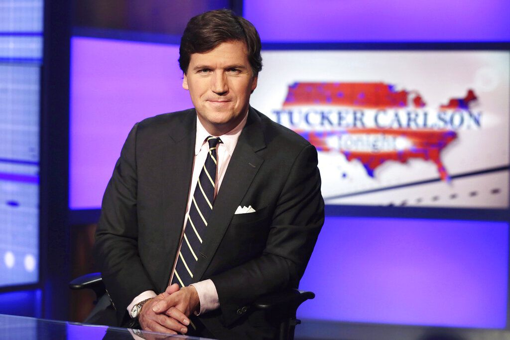 Tucker Carlson, host of “Tucker Carlson Tonight,” poses for photos in a Fox News Channel studio on March 2, 2017, in New York. Utah Gov. Spencer Cox called out Carlson for using a misleading video as part of his tirade last week against the Utah Republican for, among other things, sharing his preferred pronouns in an online conversation with high school students.