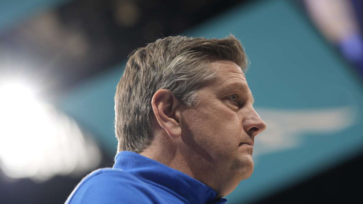 Minnesota Timberwolves head coach Chris Finch looks on in the first half of an NBA basketball game against the Denver Nuggets, Friday, April 1, 2022, in Denver.