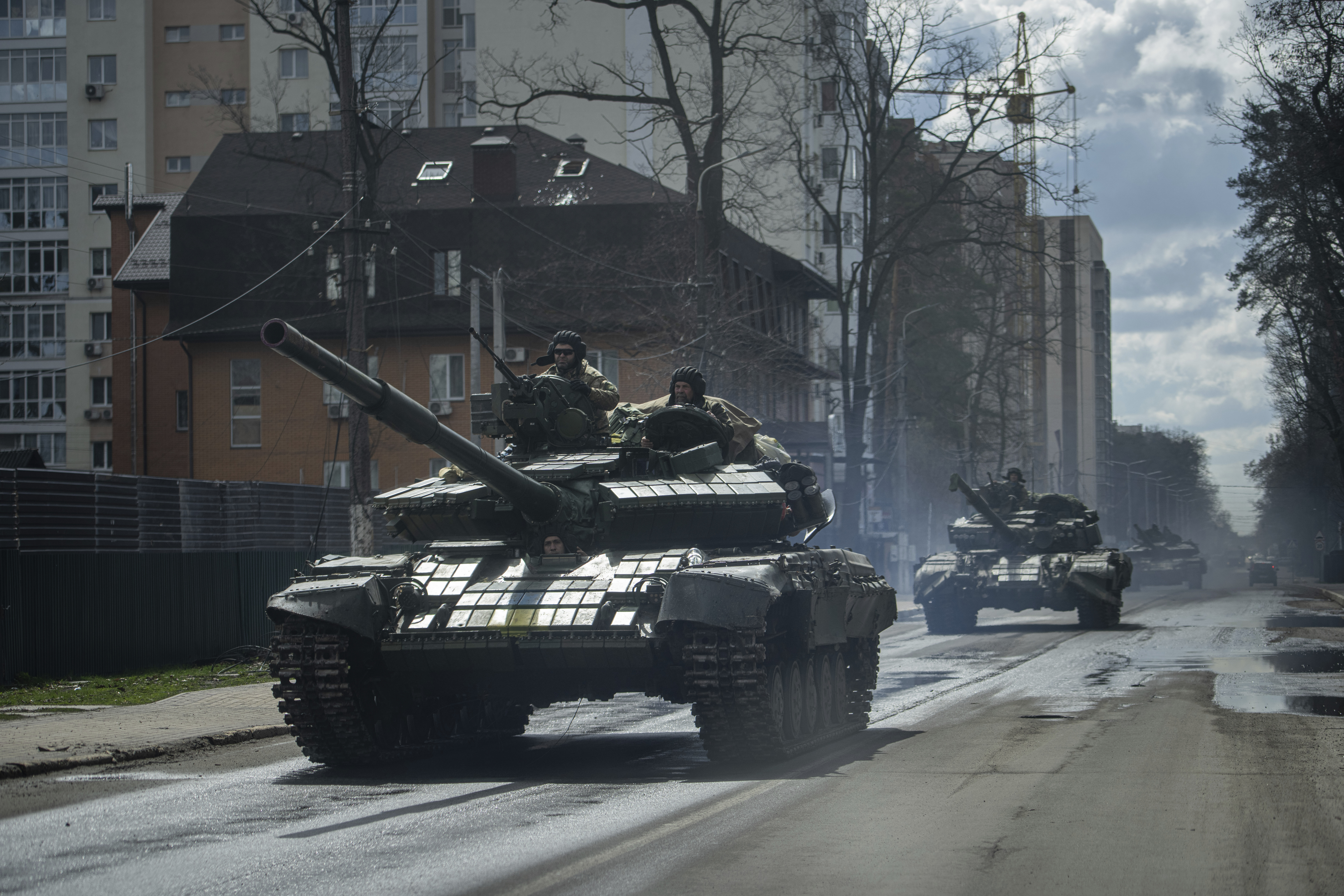 Ukrainian tanks move in a street in Irpin, in the outskirts of Kyiv, Ukraine, Monday. Russian President Vladimir Putin vowed Tuesday that Russia's offensive in Ukraine would continue until its goals are fulfilled.