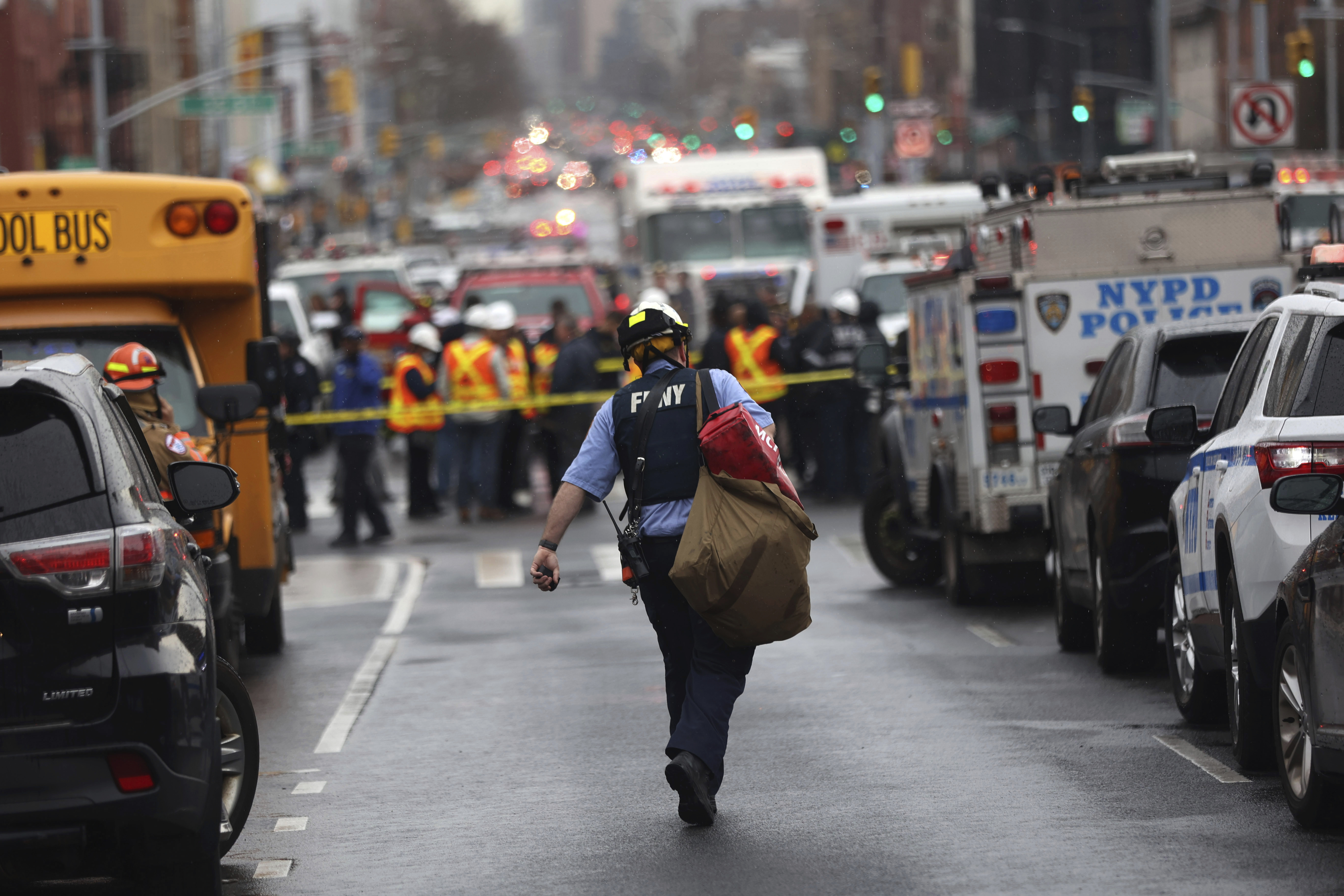 Law enforcement gather near the entrance to a subway stop in the Brooklyn borough of New York, Tuesday.