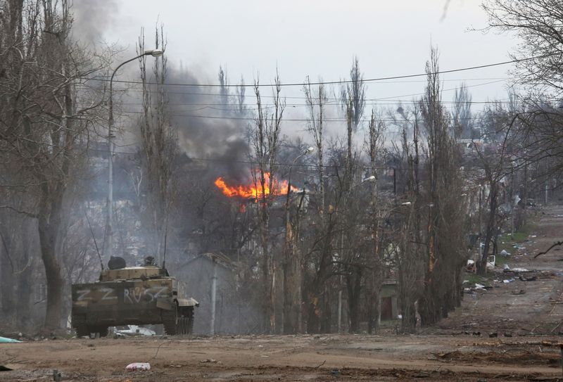 An armored vehicle of pro-Russian troops is seen in the street during the Ukraine-Russia conflict in the southern port city of Mariupol, Ukraine Monday.