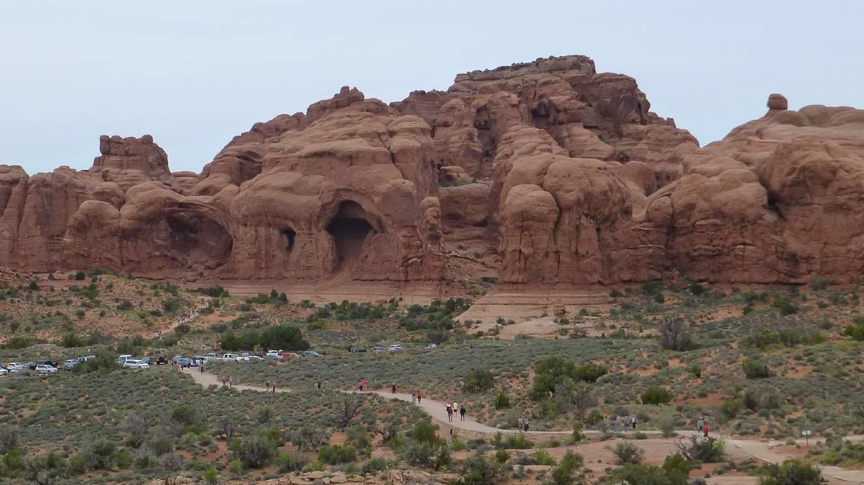 An undated photo of visitors at Arches National Park. The park is currently testing a timed entry system to deal with spring and summer surges.