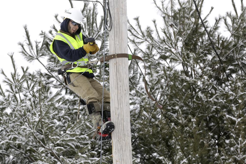 Trevor Haskins, of Waitsfield and Champlain Valley Telecom, works to run fiber optic cable to a home in Concord, Vt., Feb. 10. The nationwide need to connect homes and businesses to high-speed broadband services was highlighted by the COVID-19 pandemic and officials say that while there is lots of money available, supply and labor shortages are making the expansion a challenge.