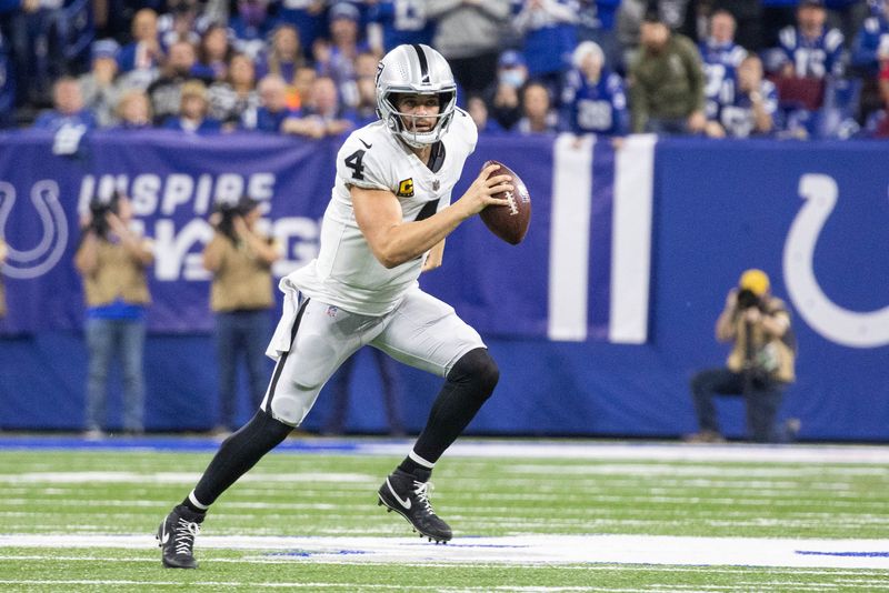 FILE PHOTO: Jan 2, 2022; Indianapolis, Indiana, USA; Las Vegas Raiders quarterback Derek Carr (4) runs the ball in the first half against the Indianapolis Colts at Lucas Oil Stadium.