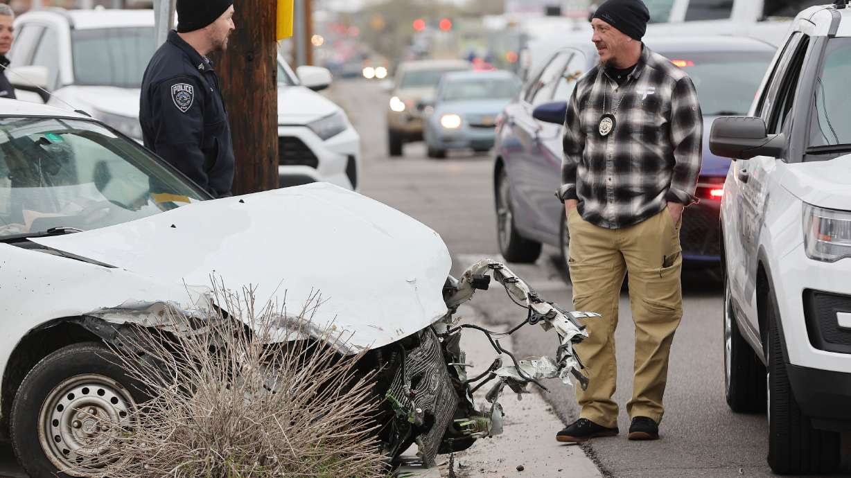 Unified Police investigate the scene of an collision on 700 East and 3300 South in Salt Lake City on Wednesday.
