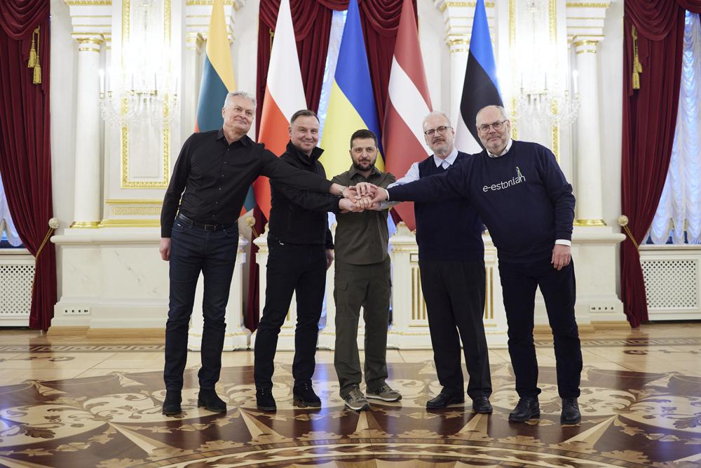 From left: Lithuania's President Gitanas Nauseda, Polish President Andrzej Duda, Ukrainian President Volodymyr Zelenskyy, Latvian President Egils Levits and Estonia's President Alar Karis pose for a picture during their meeting in Kyiv, Ukraine, Wednesday. The presidents of four countries on Russia's doorstep have underscored their support for Ukraine in a visit to the embattled country. 