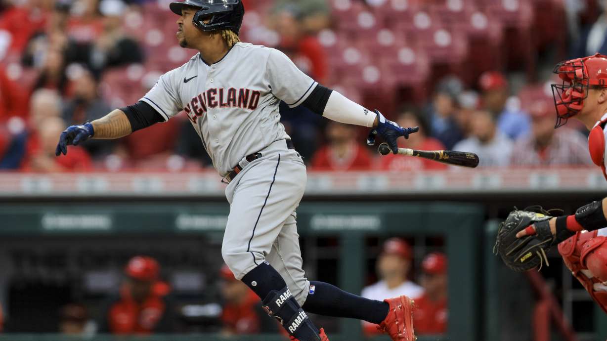 Cleveland Guardians' Jose Ramirez watches his two-run home run during the fourth inning of a baseball game against the Cincinnati Reds in Cincinnati, Wednesday, April 13, 2022.