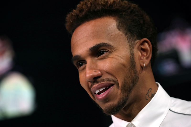 FILE PHOTO: Formula One World Champion, Mercedes' Lewis Hamilton speaks ahead of the United States Grand Prix during an interview with Reuters at the Nasdaq Market Site in New York City, New York, U.S., October 17, 2018.