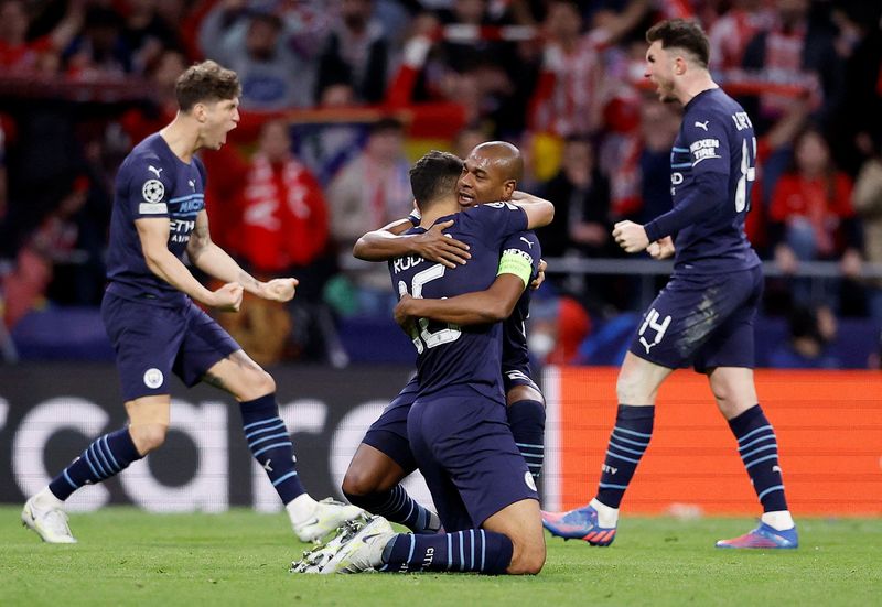 Soccer Football - Champions League - Quarter Final - Second Leg - Atletico Madrid v Manchester City - Wanda Metropolitano, Madrid, Spain - April 13, 2022 Manchester City's Rodri celebrates with Fernandinho after the match