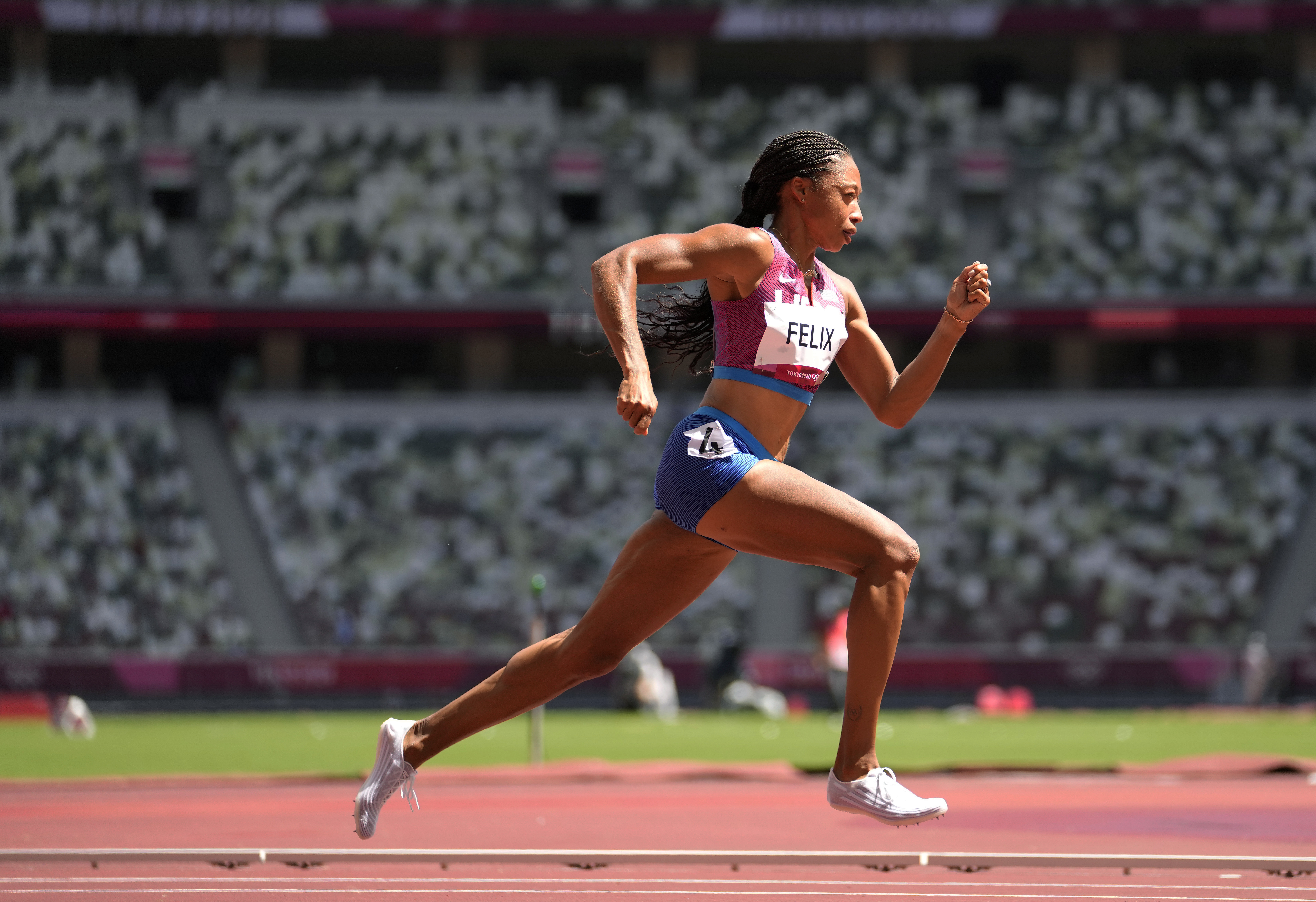FILE - Allyson Felix, of United States races in a heat of the women's 400 meters at the 2020 Summer Olympics, Aug. 3, 2021, in Tokyo, Japan. Felix says she will retire after the 2022 season. 