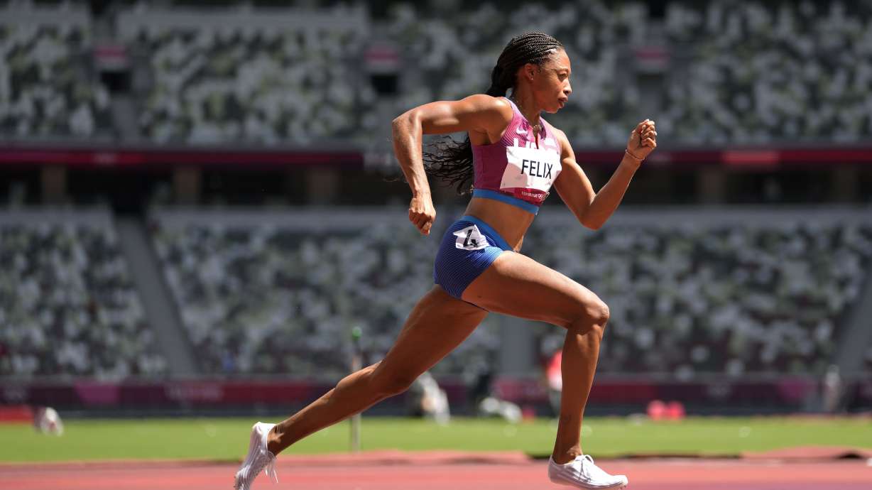 FILE - Allyson Felix, of United States races in a heat of the women's 400 meters at the 2020 Summer Olympics, Aug. 3, 2021, in Tokyo, Japan. Felix says she will retire after the 2022 season.