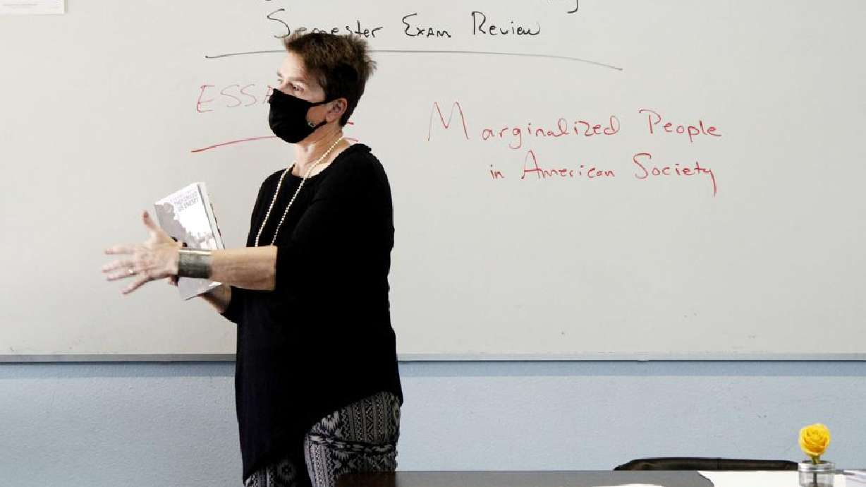History teacher Wendy Leighton speaks about marginalized with her students at Monte del Sol Charter School, Dec. 3, 2021, in Santa Fe, N.M. Americans are deeply divided over how much children in K-12 schools should be taught about racism and sexuality, a new poll says.