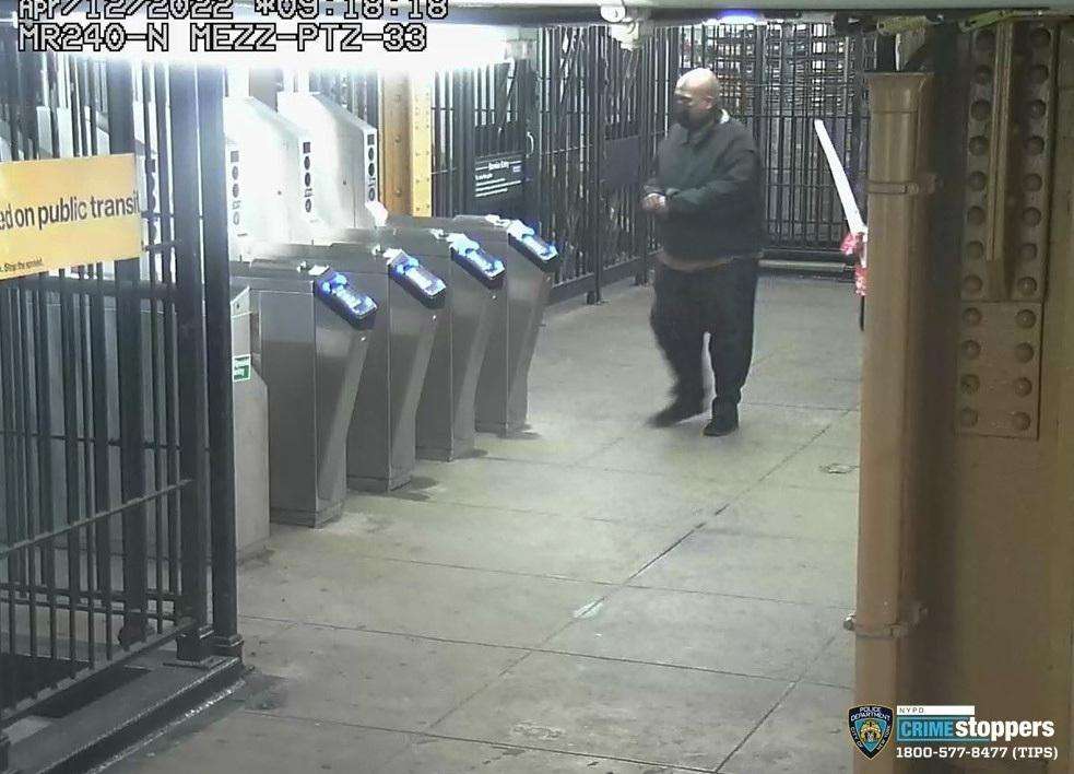 This image provided by New York Police Department on Wednesday, shows suspected subway shooter Frank R. James, 62, leaving a subway station after his attack on a subway train Tuesday.
